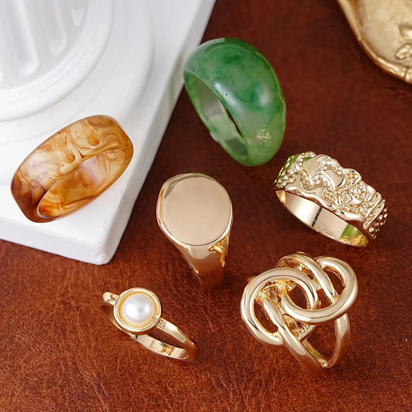 Luxe Resin Statement Ring Set featuring gold-tone statement rings, marbled resin bands, and a pearl accent ring.