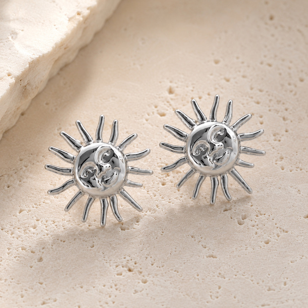 Silver Sun Goddess Stud Earrings featuring a detailed celestial sun face with polished rays.