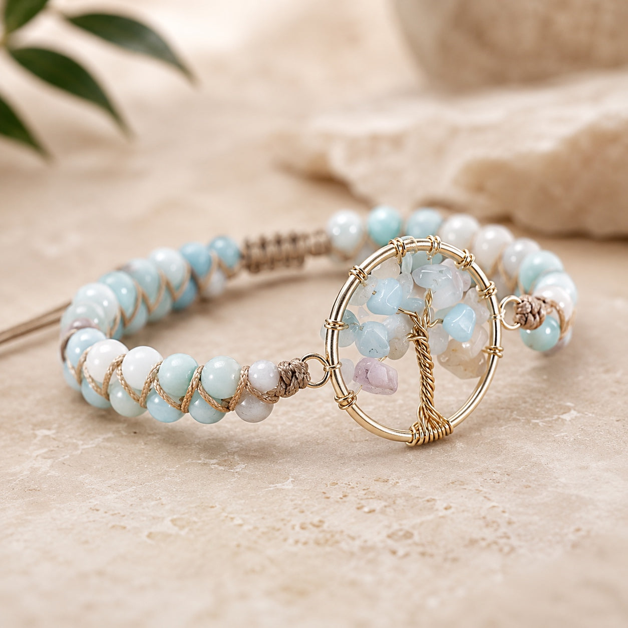 Angled view of the Amazonite Tree Of Life Bracelet showcasing natural amazonite beads, gemstone tree of life centerpiece, and adjustable braided cord.