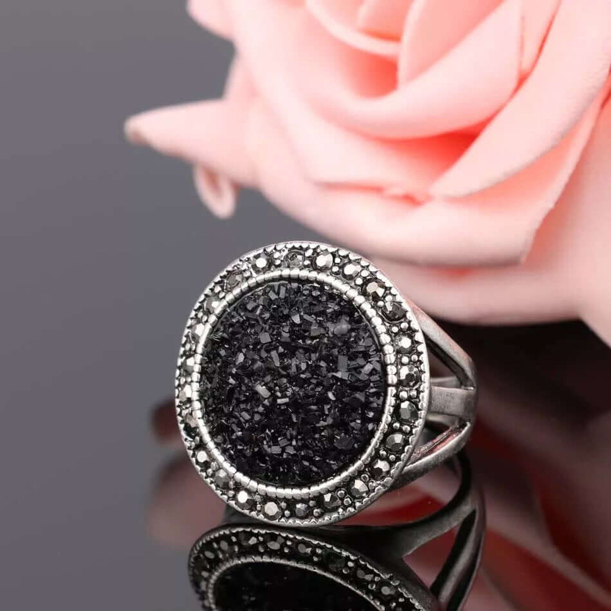 Front view of the Black Druzy Statement Ring with round black druzy stone and antique silver band.