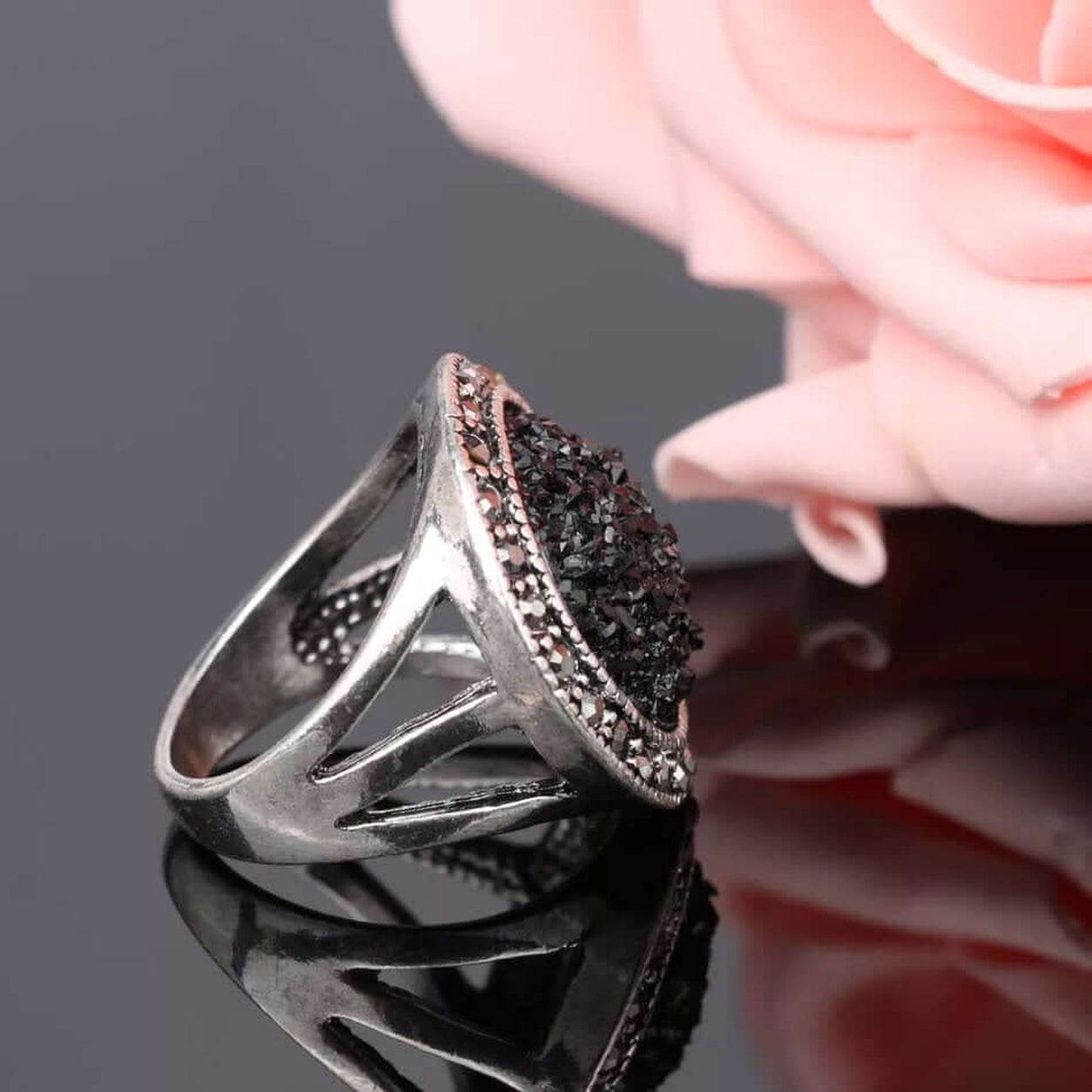 Side view of the Black Druzy Statement Ring showing the elevated split-shank silver band and textured druzy stone.