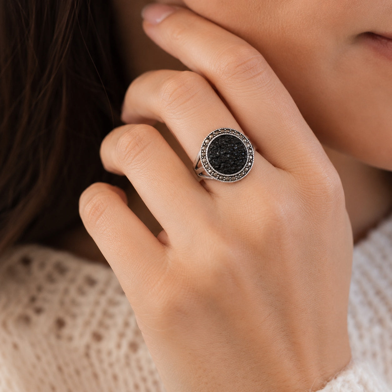 Woman wearing the Black Druzy Statement Ring featuring a sparkling black druzy stone in a vintage silver setting.