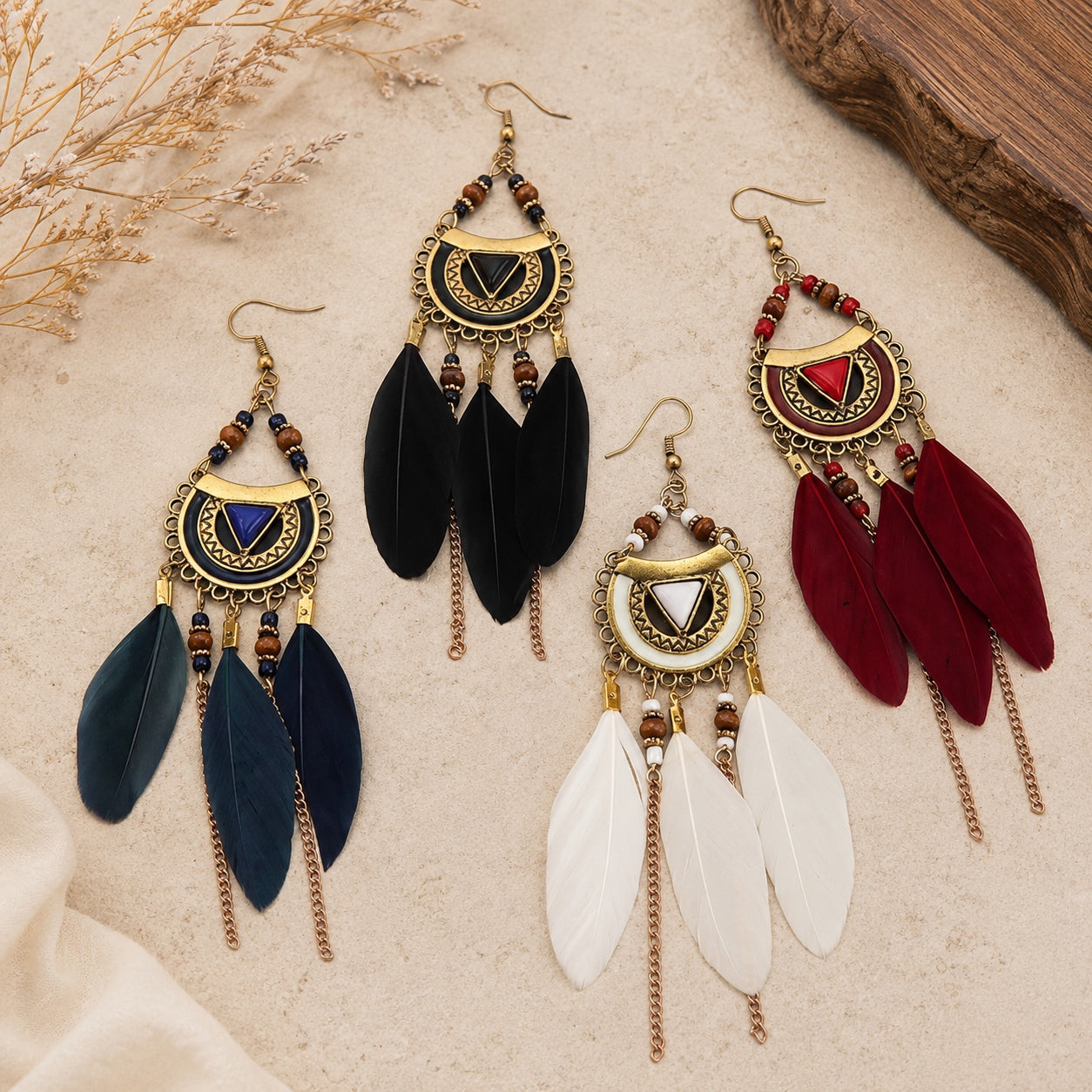 Boho Feather Statement Earrings available in blue, black, white, and red with antique gold crescent design and feather tassels.