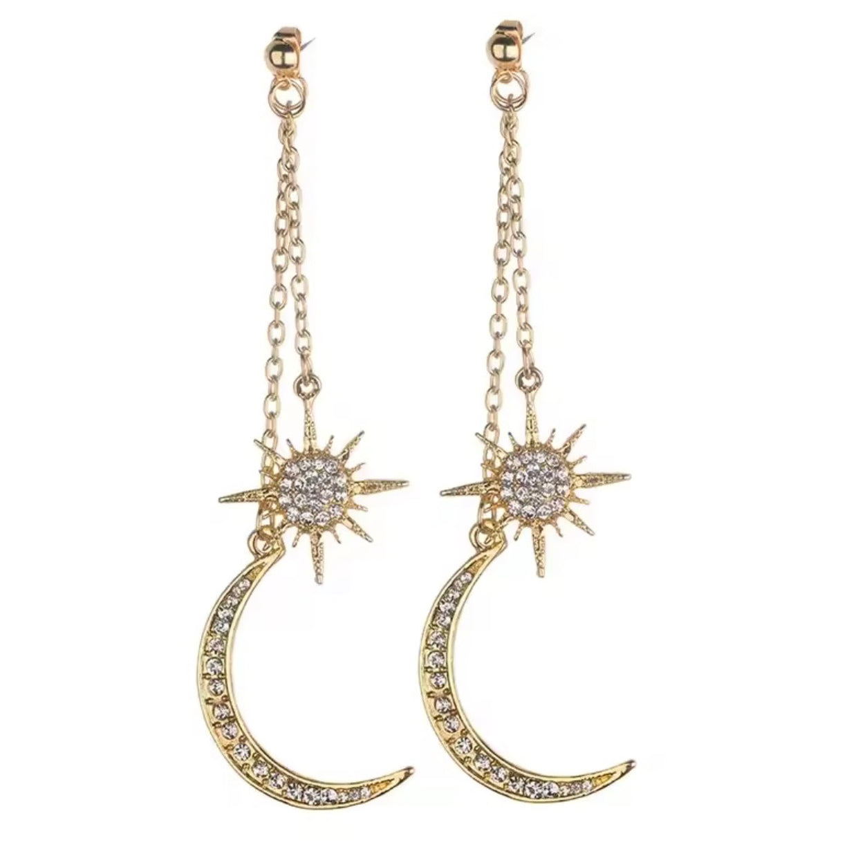 Gold Celestial Dangle Earrings with crystal starburst and crescent moon charms isolated on a white background.
