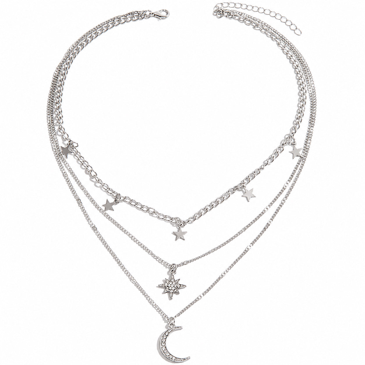 Silver celestial layered necklace with three chains, star charms, starburst pendant and crescent moon.