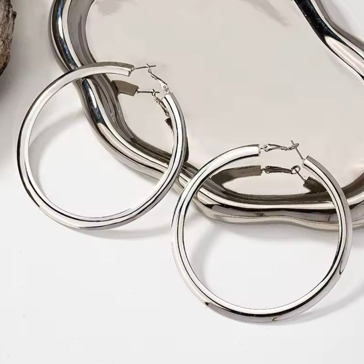 Classic Hoop Earrings in silver with a polished finish, featuring timeless lightweight hoop earrings for everyday wear.
