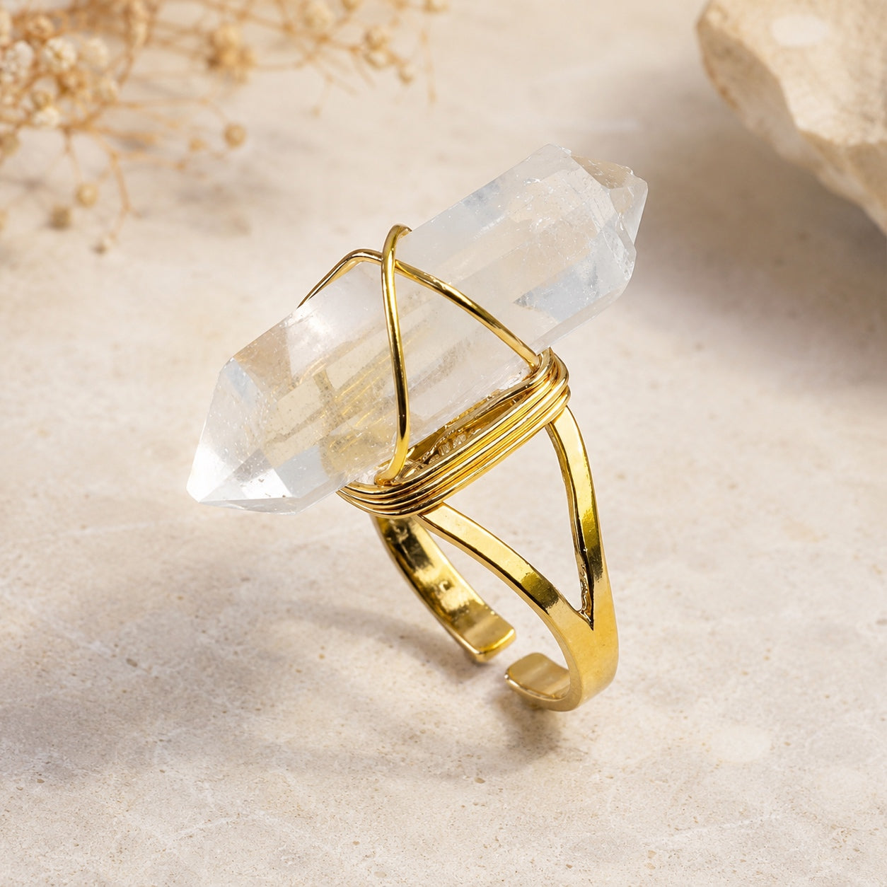 Gold Clear Quartz Crystal Ring with a natural double-point quartz crystal and adjustable gold-tone band.
