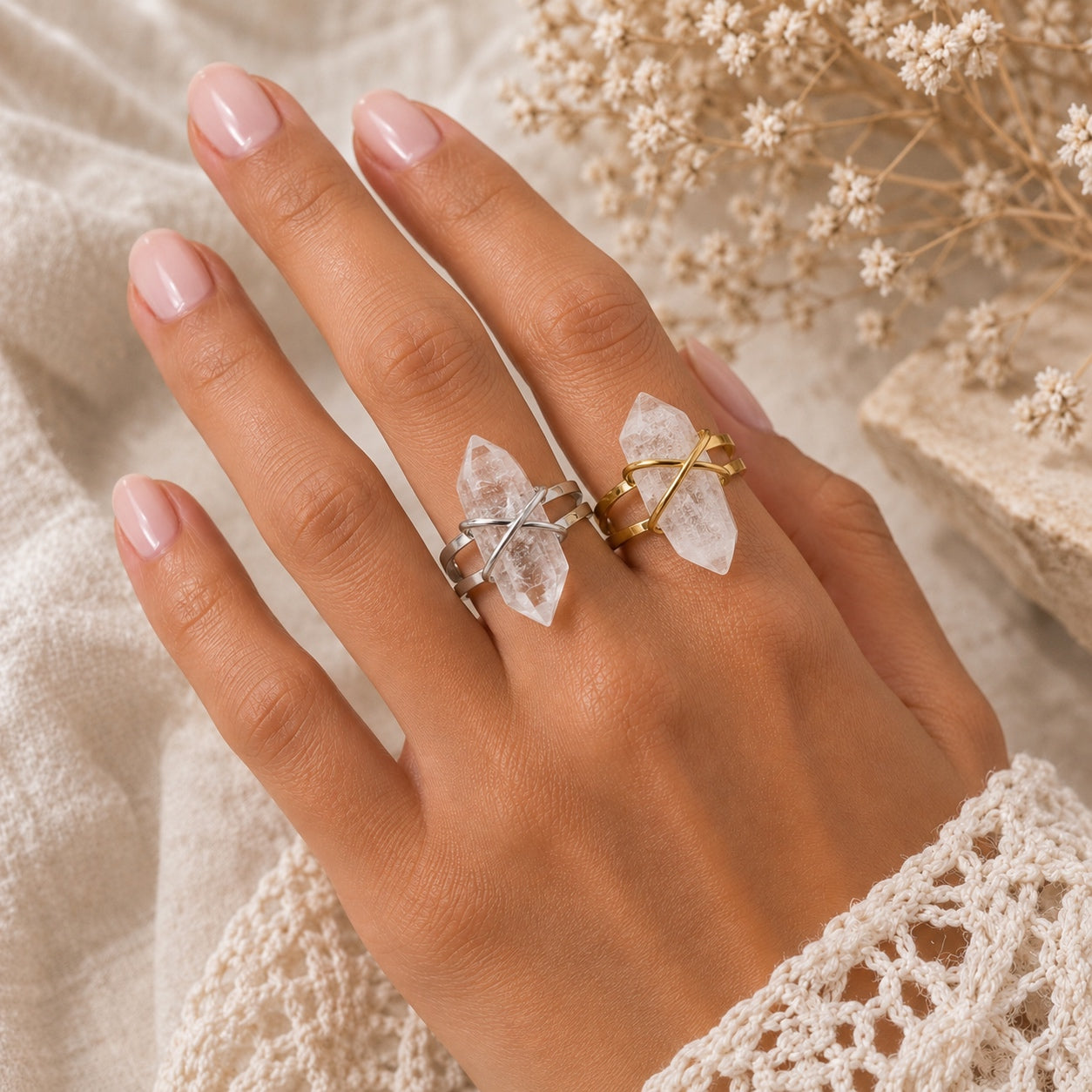 Model wearing silver and gold Clear Quartz Crystal Rings with natural quartz stones on adjustable bands.