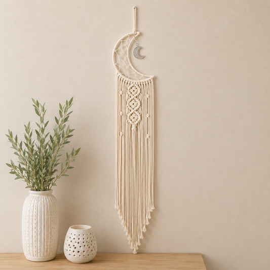 Crescent Moon Macrame Wall Hanging displayed above a wooden table with ceramic vases, adding boho charm to a neutral home décor setting.