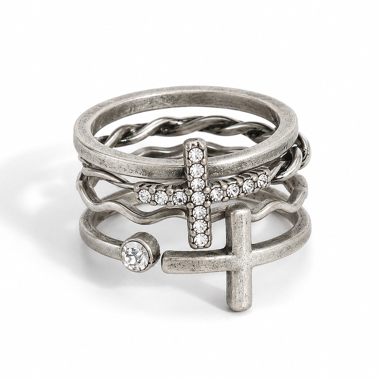 Silver Crosses Ring Set with five stackable rings featuring crystal cross, twisted bands, and minimalist styles.