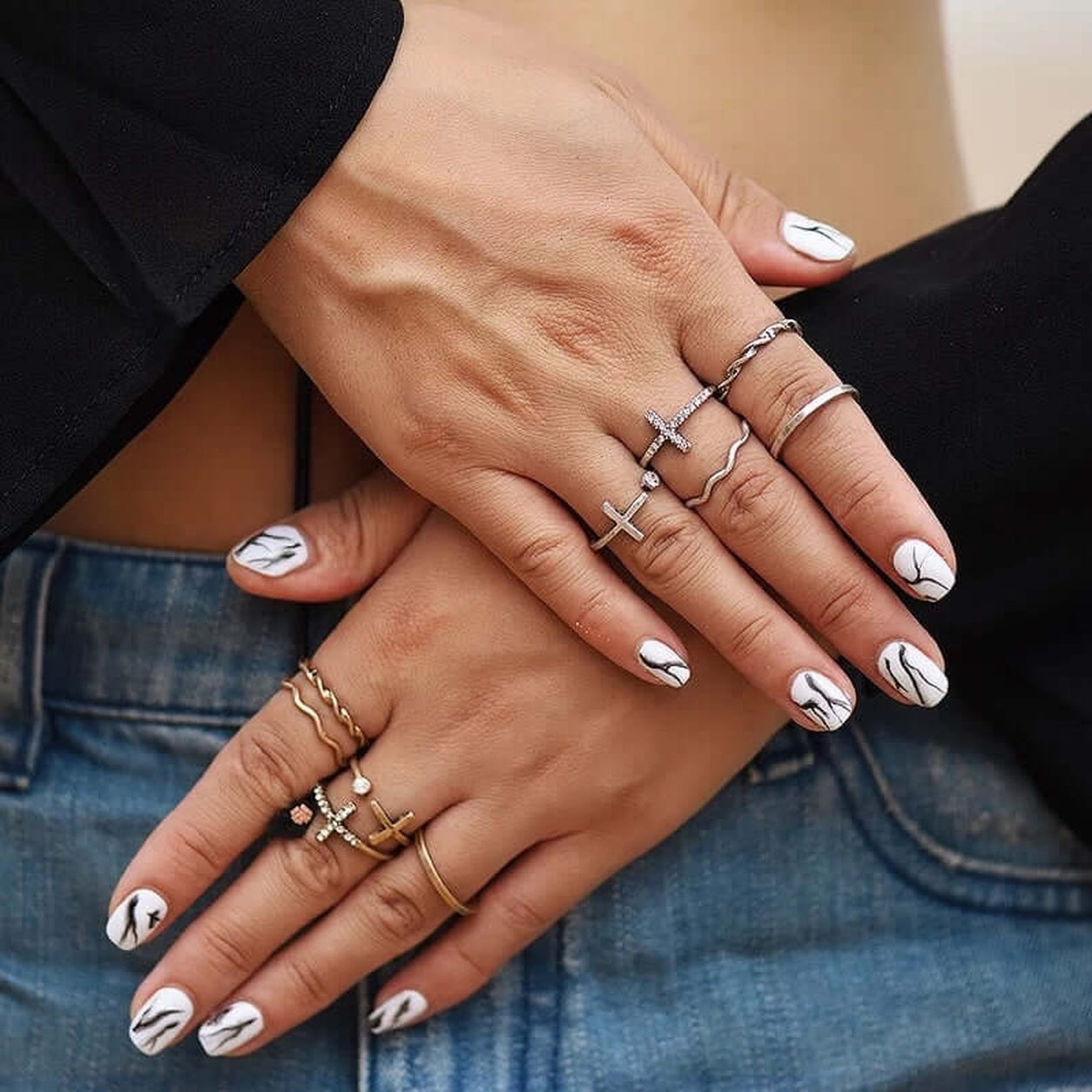 Crosses Ring Set worn on both hands featuring stacked gold and silver cross rings with rhinestone accents.