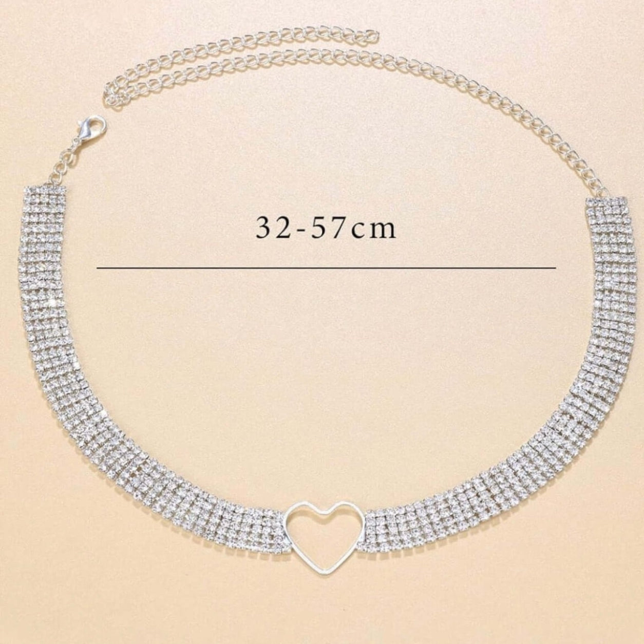 Crystal Heart Choker Necklace with adjustable extender chain, silver-tone heart centerpiece, and multi-row rhinestone design.