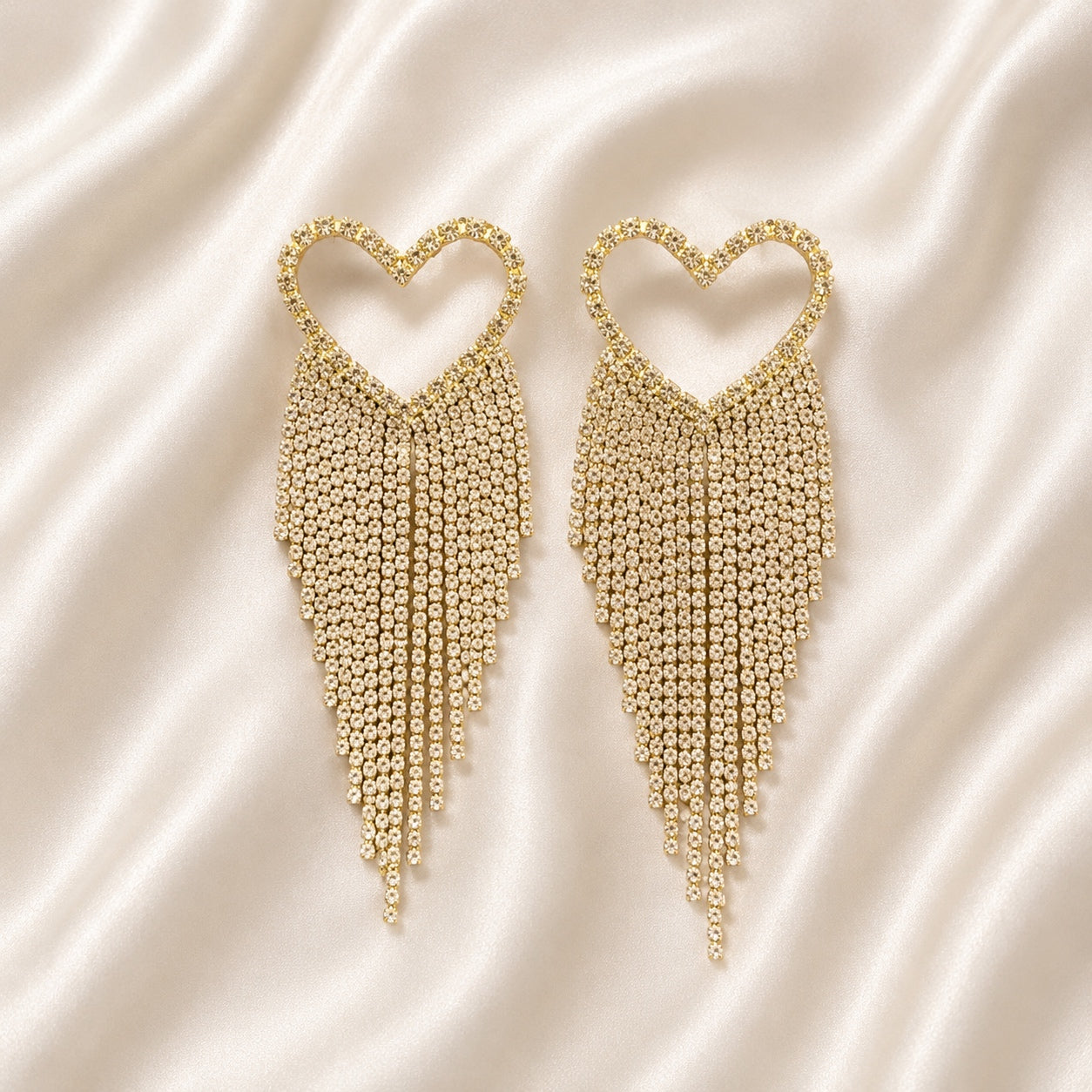 Gold Crystal Heart Dangle Earrings featuring sparkling rhinestones and elegant crystal tassel fringe for bridal, prom, and evening wear.