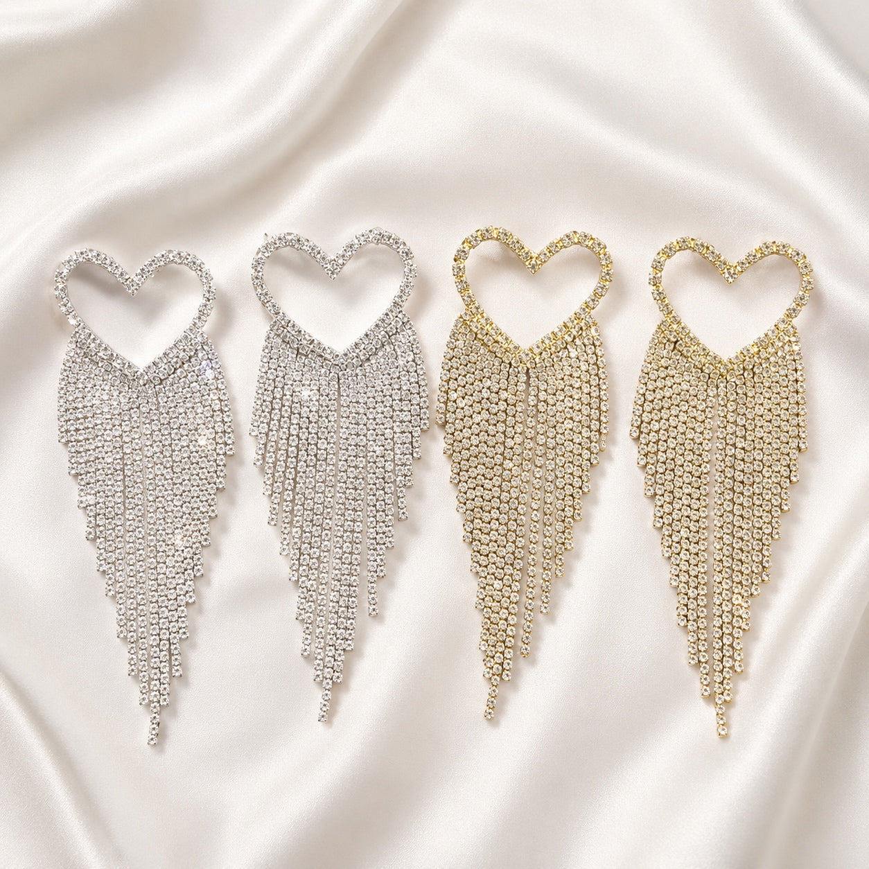 Crystal Heart Dangle Earrings available in silver and gold with sparkling rhinestone heart tops and long crystal fringe tassels.