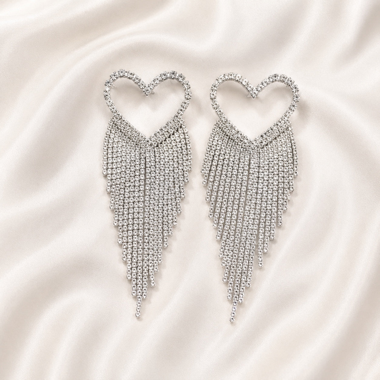 Silver Crystal Heart Dangle Earrings with rhinestone heart design and cascading crystal fringe statement earrings for weddings, parties, and special occasions.