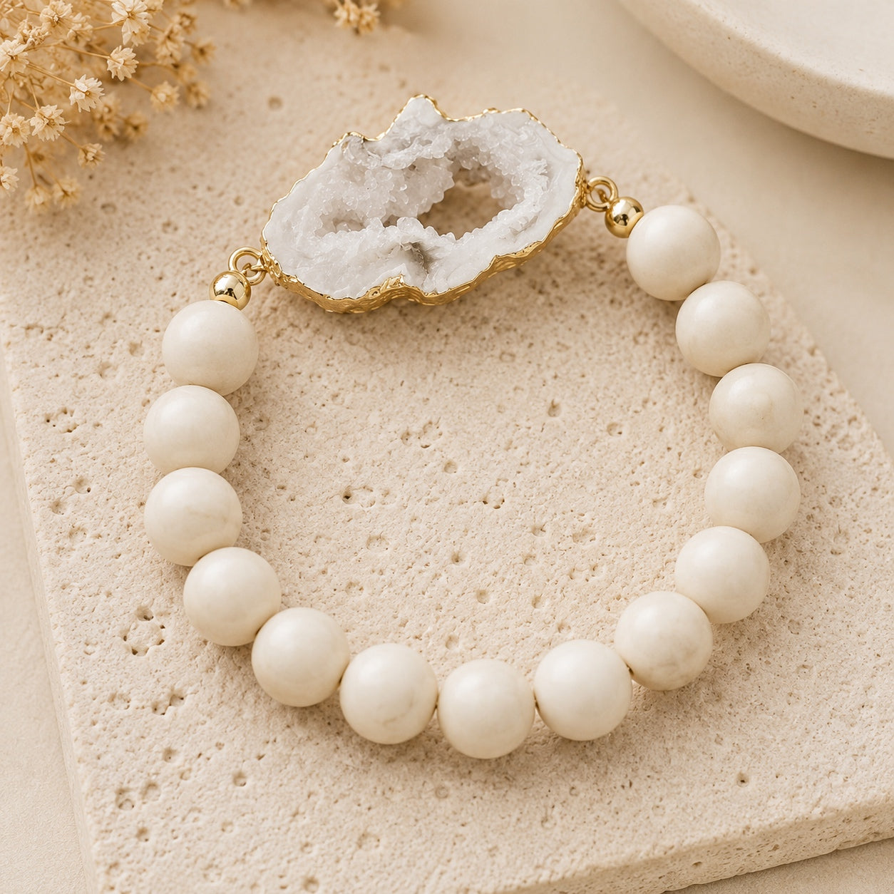 Druzy and natural stone beaded bracelet from the Crystal & Stone Bracelet Stack featuring a white druzy centerpiece and gold-tone accents.