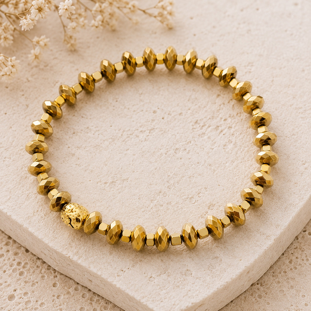 Gold-tone faceted beaded bracelet from the Crystal & Stone Bracelet Stack featuring polished metallic beads and a stretch design.