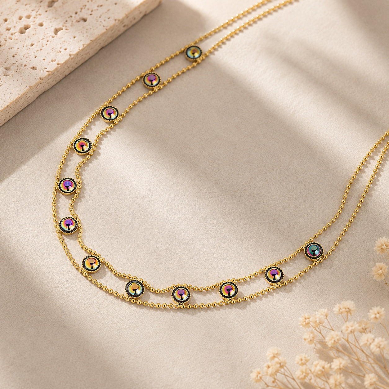 Close-up of the Dainty Gems Choker Necklace highlighting the delicate gold chains and sparkling iridescent crystal accents.