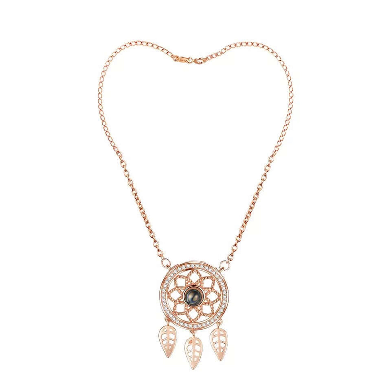 Front view of the rose gold Dreamcatcher Necklace featuring an openwork dreamcatcher pendant with leaf charms.