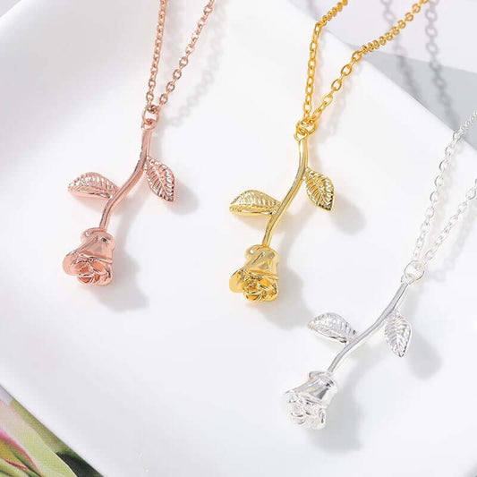 Elegant Rose Pendant Necklace shown in gold, rose gold and silver finishes with detailed floral pendant design.