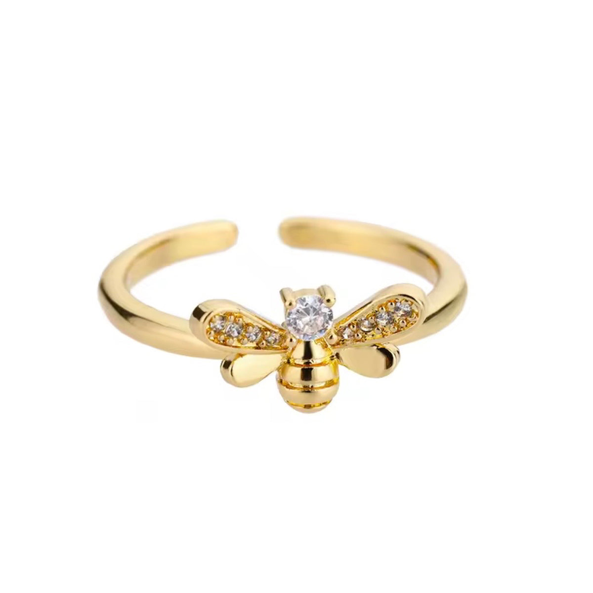 Gold bee ring with a clear center crystal, jeweled wings, and an open band on a white background
