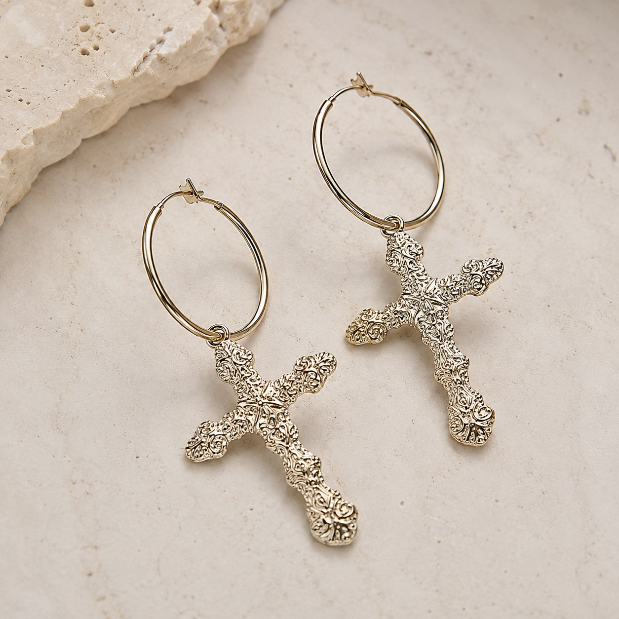 Golden Cross Hoop Earrings featuring vintage gold cross charms on polished hoop earrings with an elegant textured finish.
