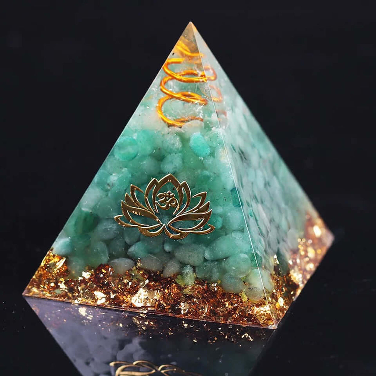 Angled view of the Green Aventurine Lotus Crystal Pyramid with copper spiral, gold foil and polished resin finish.