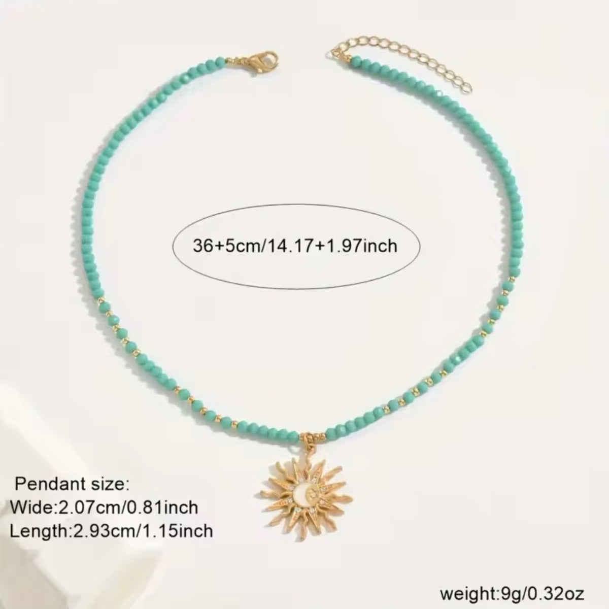 Green beaded celestial sun necklace with gold-tone pendant, adjustable 36 cm chain and 5 cm extension, with pendant measurements shown.
