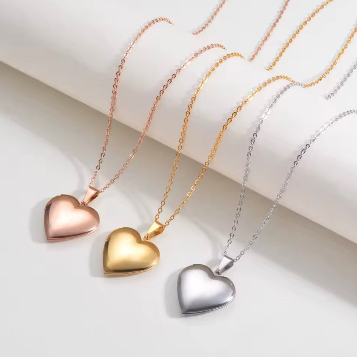 Heart Locket Necklace available in gold, silver, and rose gold finishes.