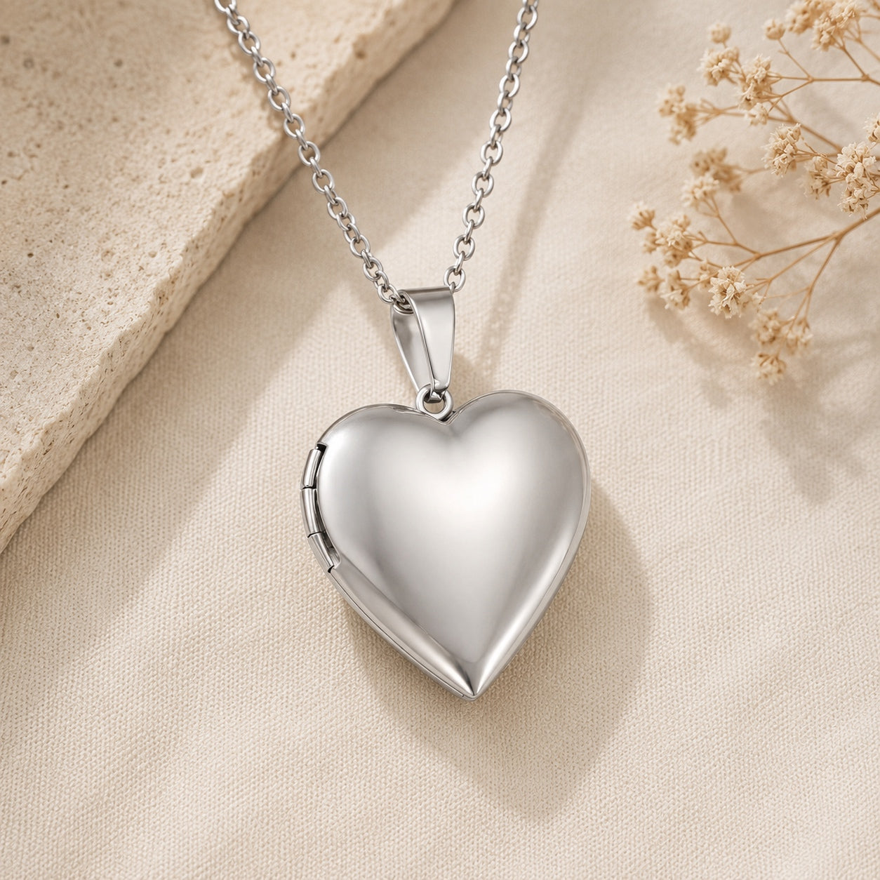 Silver Heart Locket Necklace featuring a polished heart pendant with hidden photo compartment.