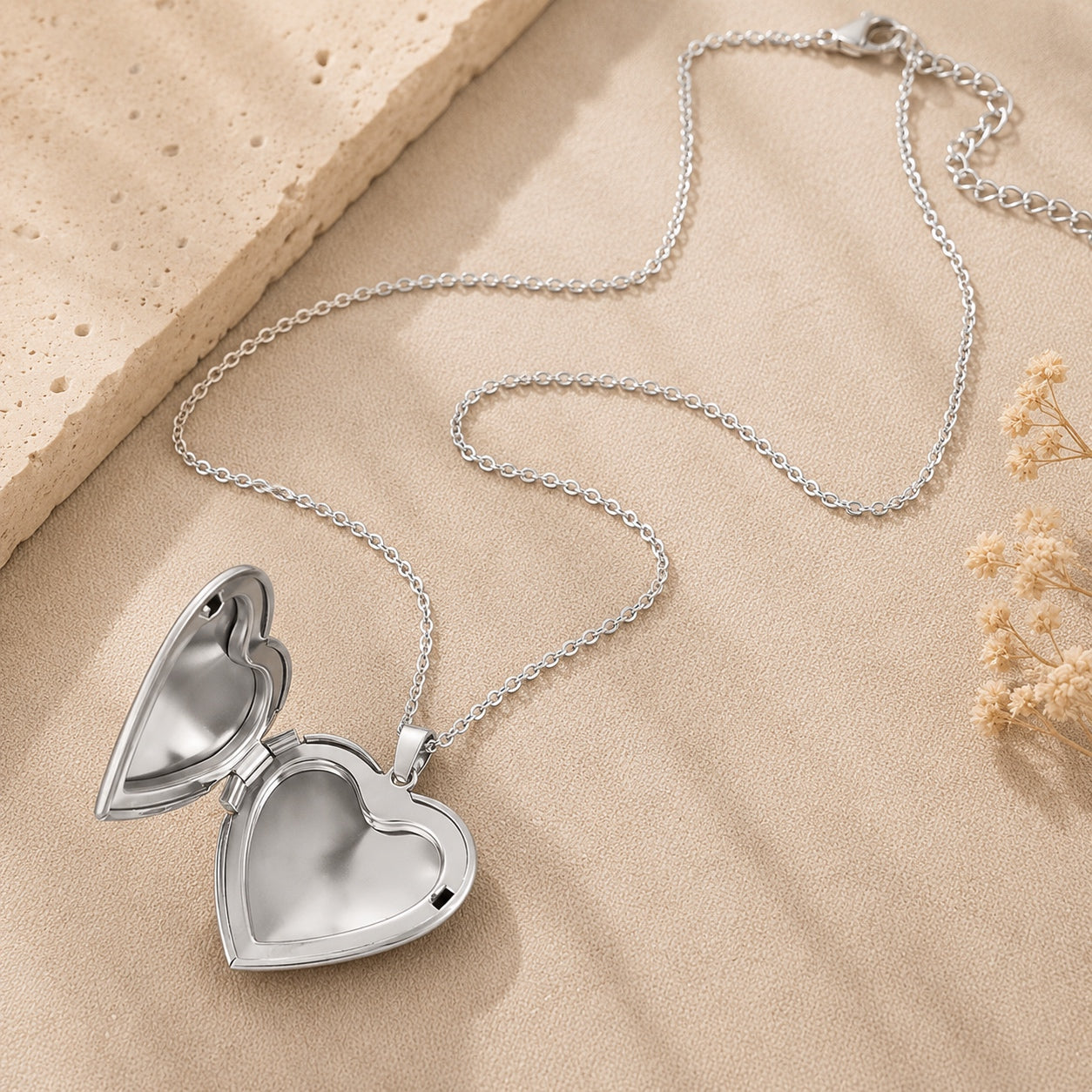 Open silver Heart Locket Necklace revealing the interior photo compartment.