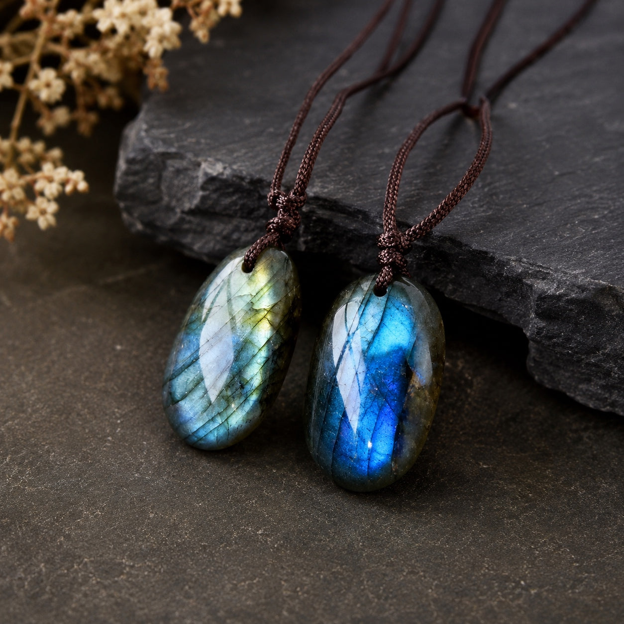 Two Labradorite Stone Necklaces displaying the natural blue and green iridescence unique to each polished gemstone.