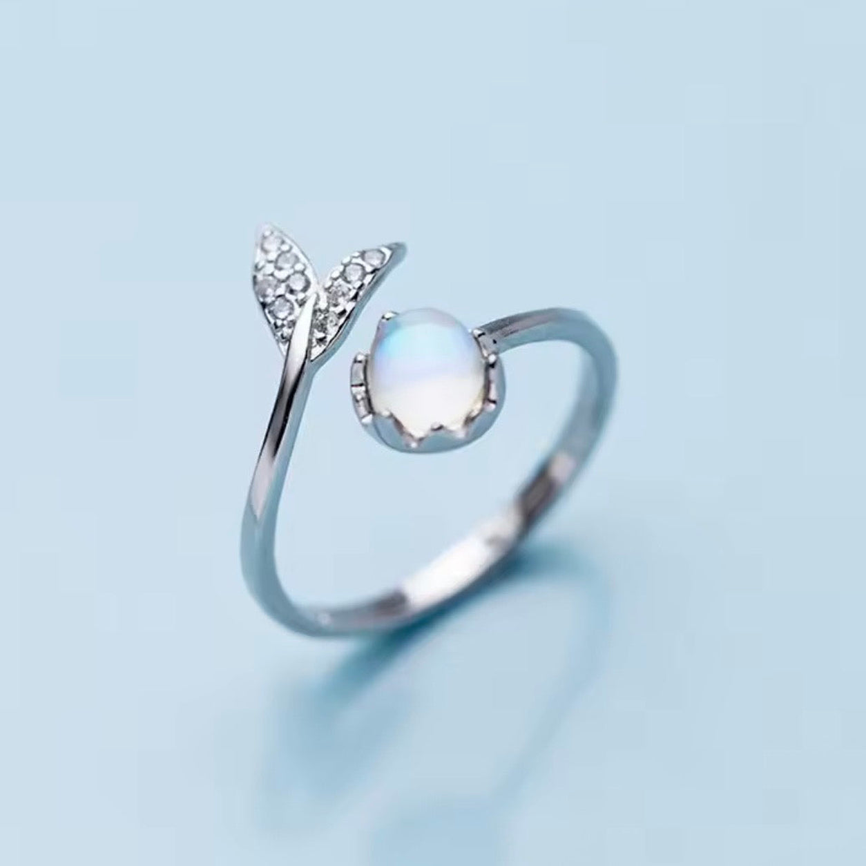 Front view of the Mermaid Moonstone Ring with an iridescent moonstone and delicate silver leaf detailing.