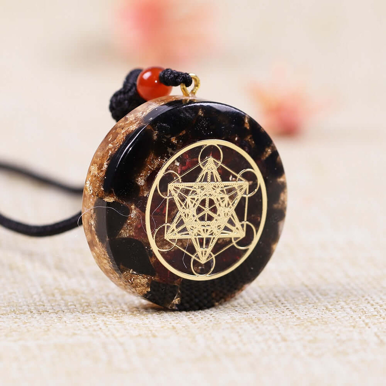 Close-up of Metatron’s Cube Obsidian Pendant Necklace highlighting the engraved geometric symbol and natural stone.