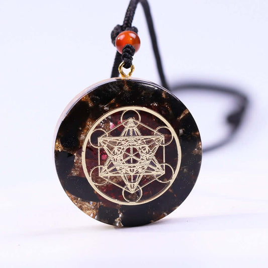 Metatron’s Cube Obsidian Pendant Necklace featuring natural obsidian, garnet accents, and sacred geometry engraving.