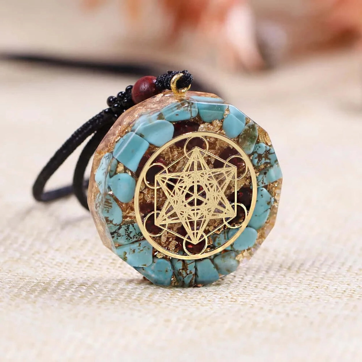 Angled view of Metatron’s Cube turquoise pendant necklace showing handcrafted resin and turquoise stone inlay.