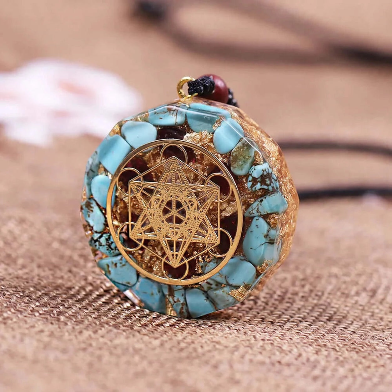Metatron’s Cube turquoise pendant necklace featuring turquoise inlay and gold sacred geometry pendant detail.