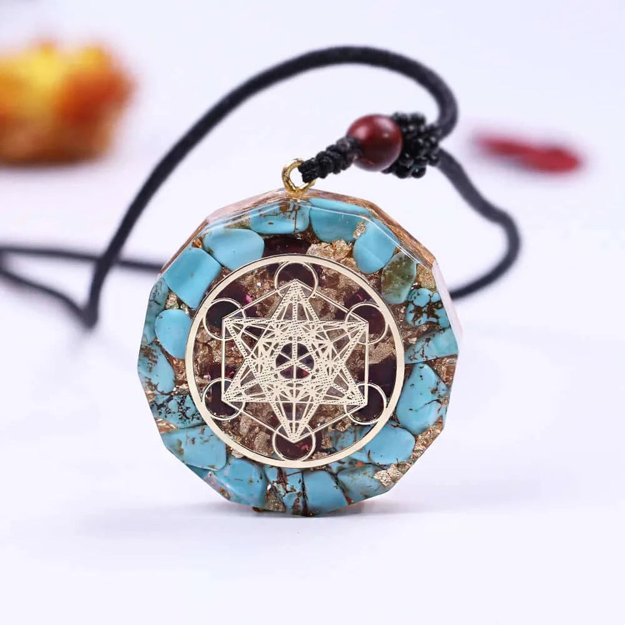 Metatron’s Cube turquoise pendant necklace with natural turquoise stone chips and sacred geometry symbol on adjustable cord.