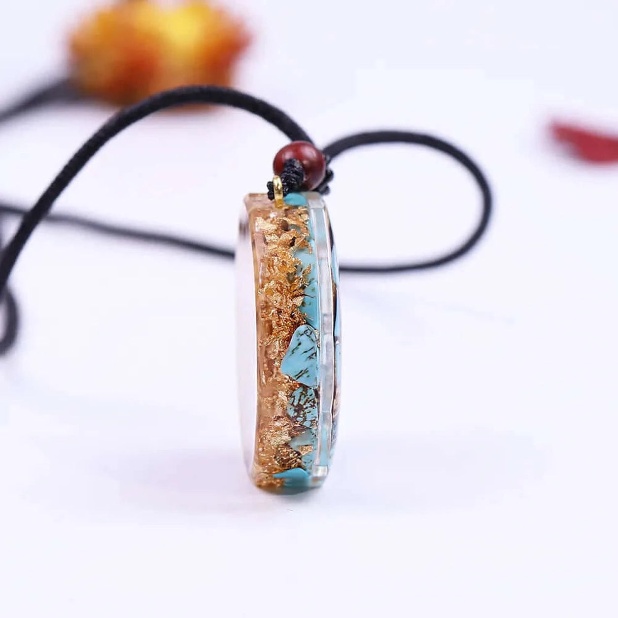Side profile of Metatron’s Cube turquoise pendant necklace showing turquoise stone inlay and sacred geometry symbolism.