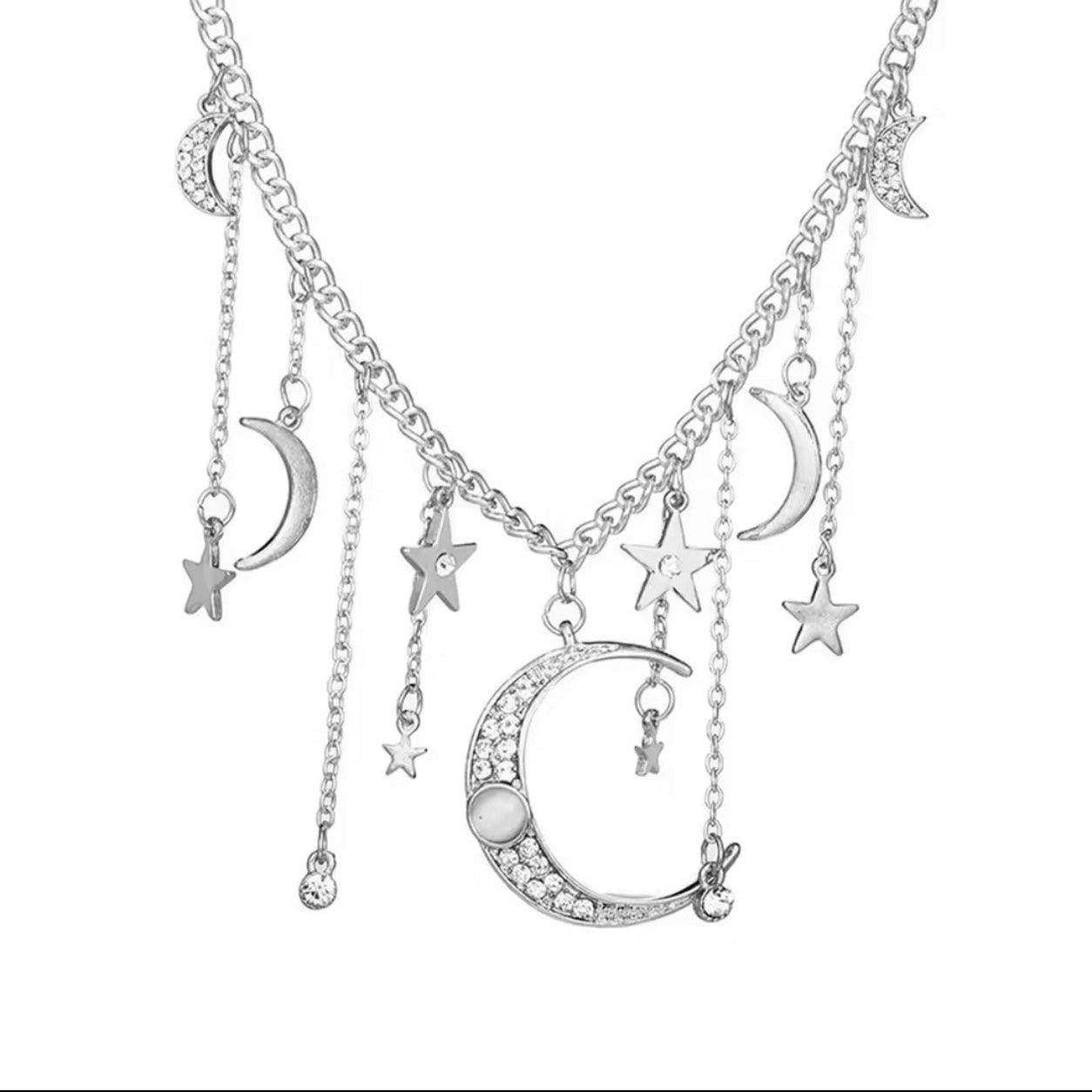 Silver charm necklace with crescent moon pendant and dangling star charms
