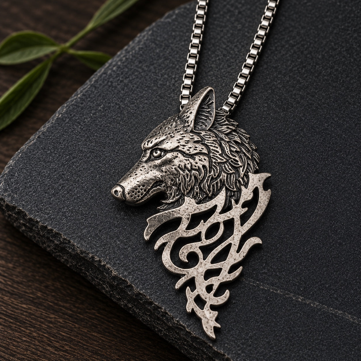 Close-up of the silver Mystic Wolf Pendant Necklace featuring an engraved wolf head pendant on a stainless steel box chain.