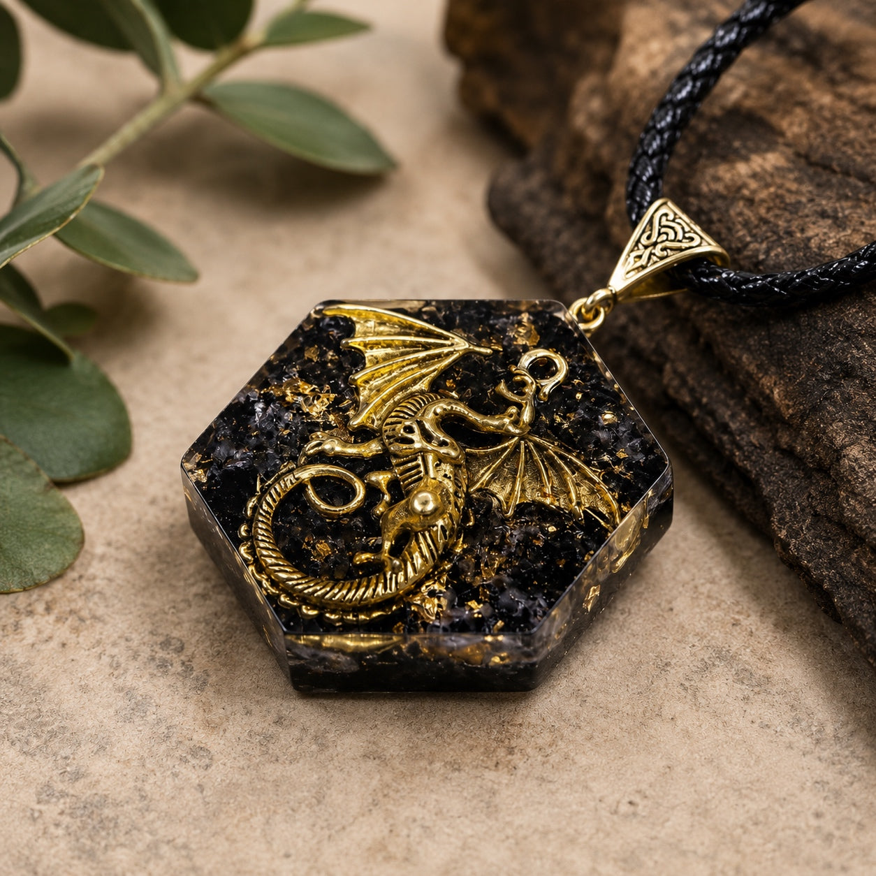 Angled close-up of the Obsidian Dragon Pendant Necklace with gold dragon detail, black obsidian crystal, and hexagon pendant.