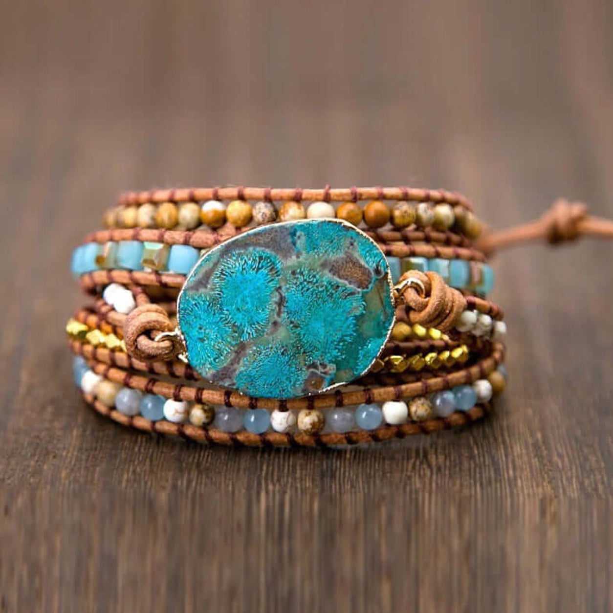 Front view of the Ocean Jasper Wrap Bracelet with polished ocean jasper centerpiece, natural gemstone beads, leather wrap, and adjustable closure.