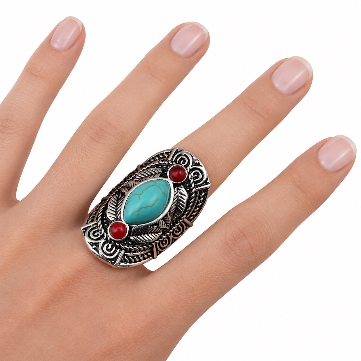 Woman wearing a Red Jasper Turquoise Tribal Ring featuring a turquoise center stone and red jasper accents.