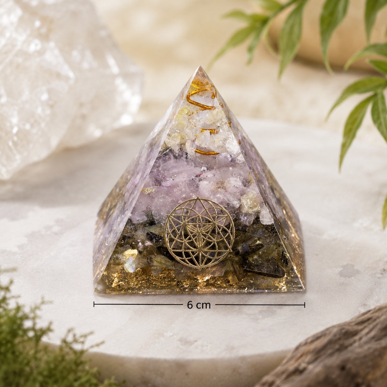 Rose Quartz & Labradorite Crystal Pyramid measuring 6 cm, shown with natural décor for size reference.
