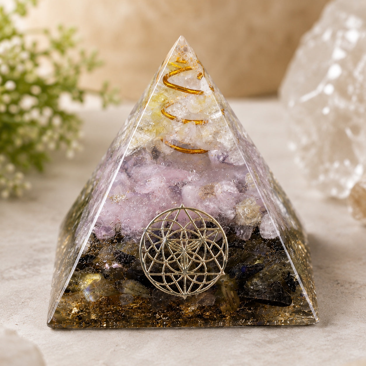 Rose Quartz & Labradorite Crystal Pyramid with copper coil and sacred geometry symbol, front view.