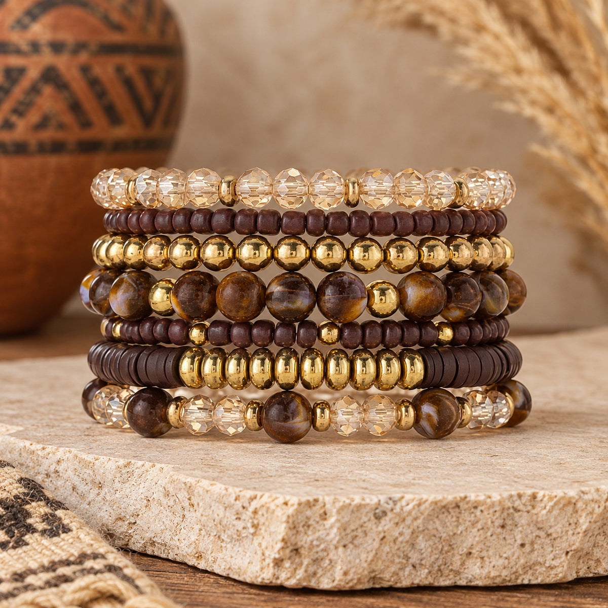 Sedona Spirit layered bracelet set displayed upright, featuring brown marbled beads, burgundy wooden-style beads, champagne crystals and gold-tone accents.