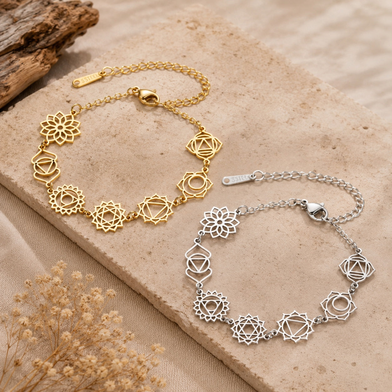 Gold and silver Seven Chakras bracelets with chakra symbols displayed on a natural stone surface.