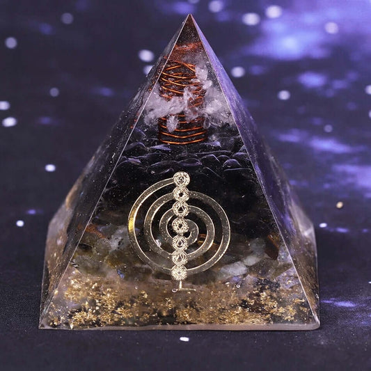 Front view of the Smoky Quartz & Labradorite Crystal Pyramid featuring a copper coil, clear crystal, gold foil, and sacred geometry symbol.
