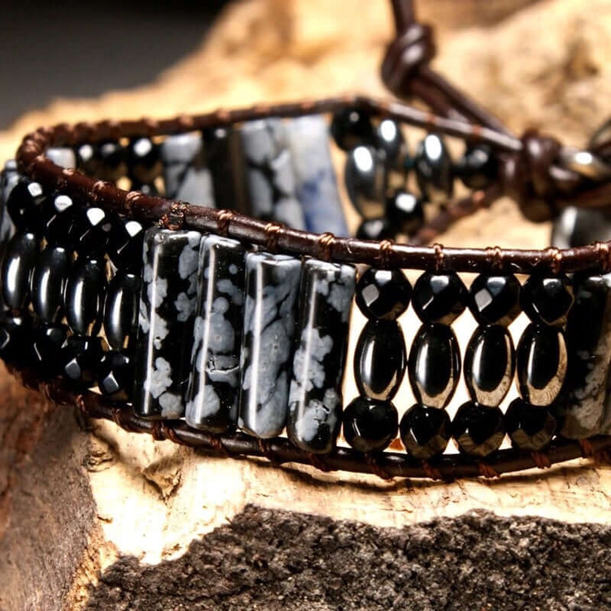 Close-up of the Snowflake Obsidian Bracelet highlighting genuine snowflake obsidian stones and black beads.